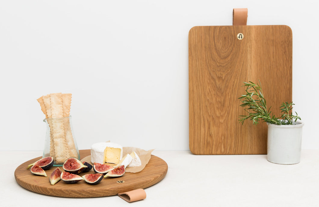 Scene Containing Round And Rectangular Cooper Bread Boards in White Oak With Figs and Cheese