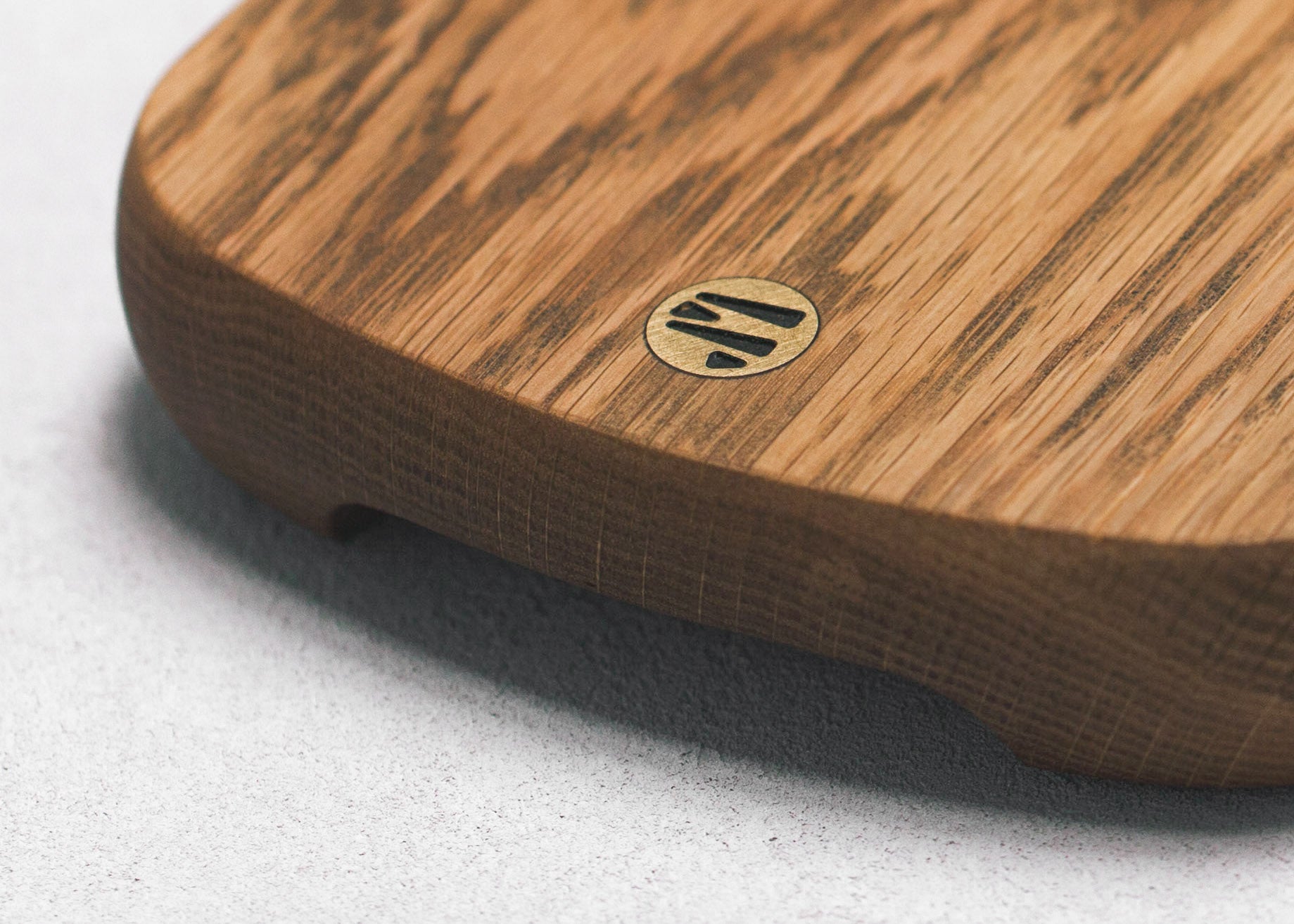 Closeup of Brass Jacob May Logo in Hudson White Oak Cutting Board