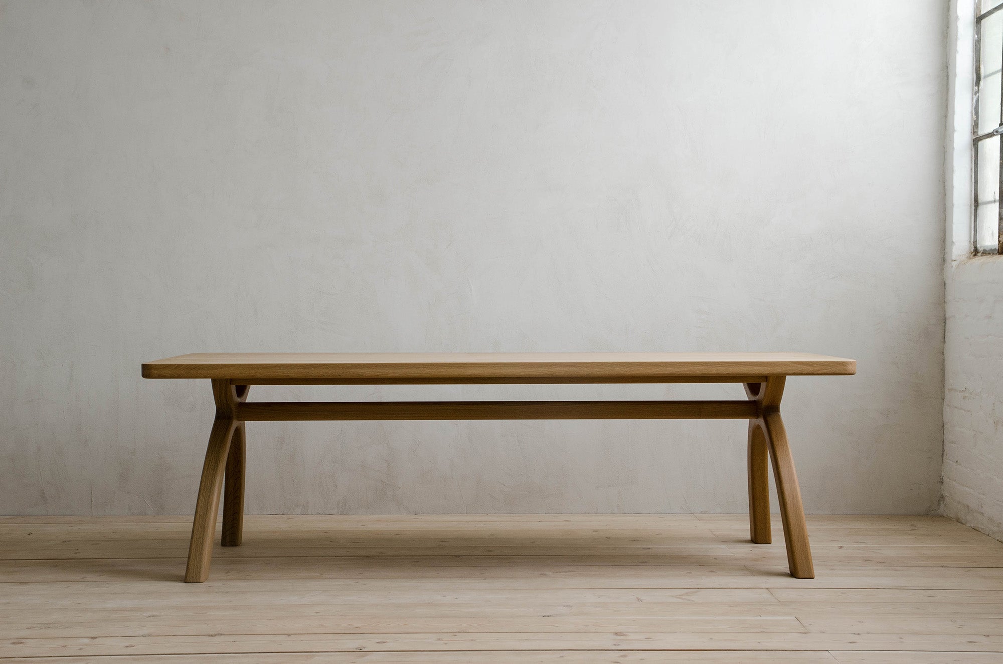 Inyo Dining Table in Natural Oak in a Modern Room