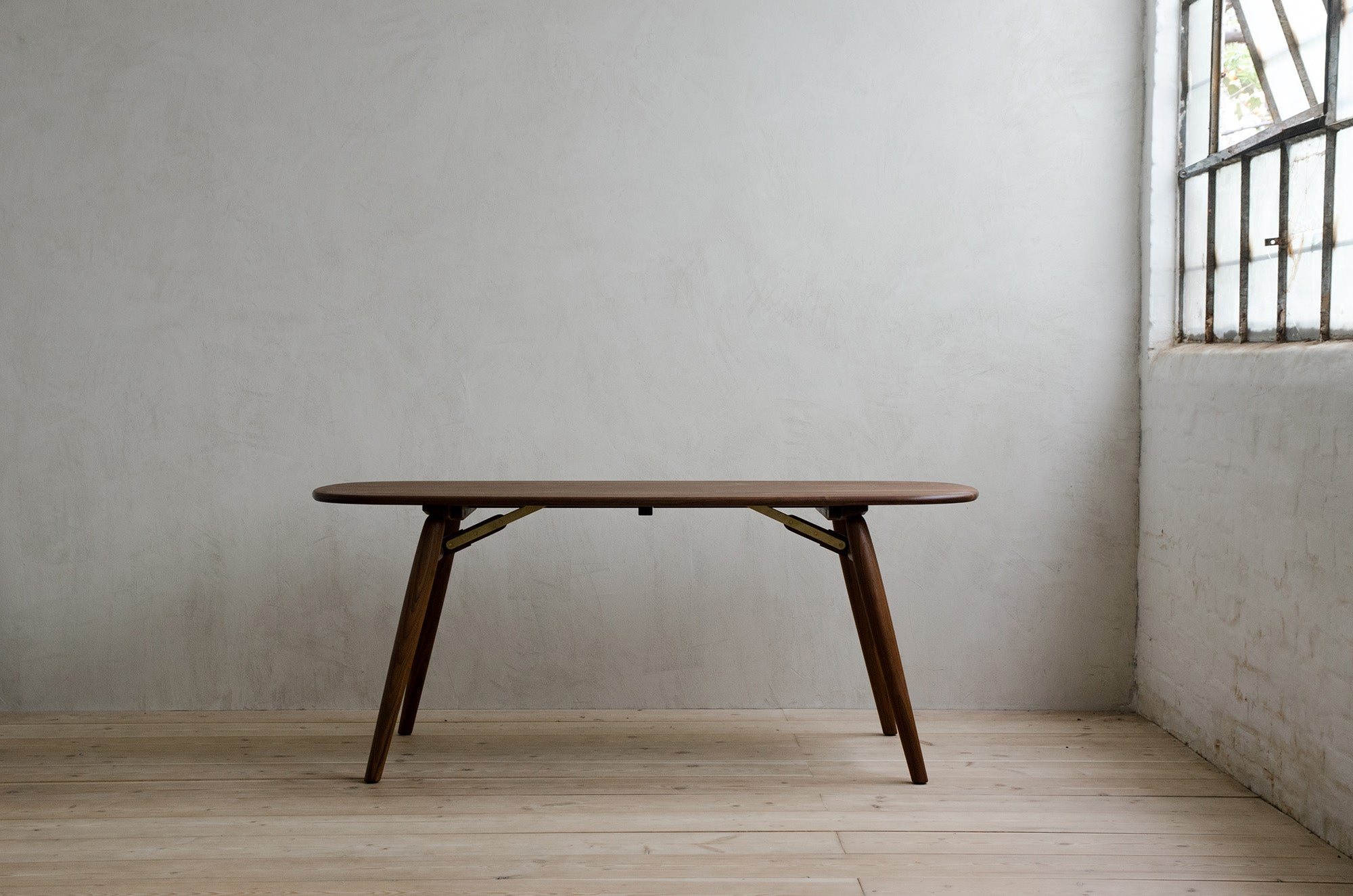 Small Natural Walnut Nomad Rectangular Dining Table Front View