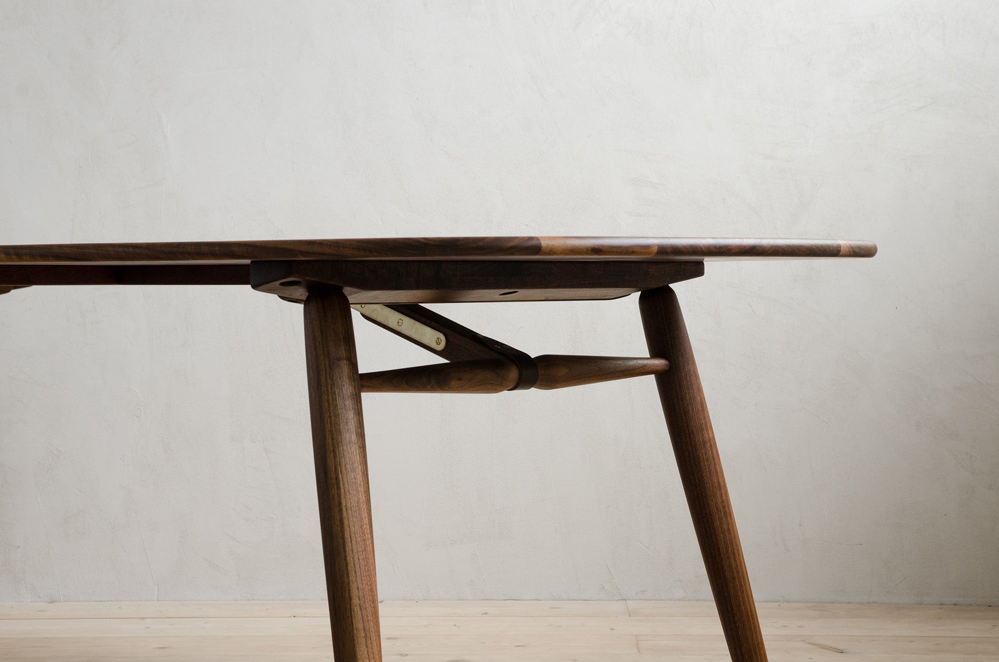 Closeup of Nomad Rectangular Dining Table With Brass Features