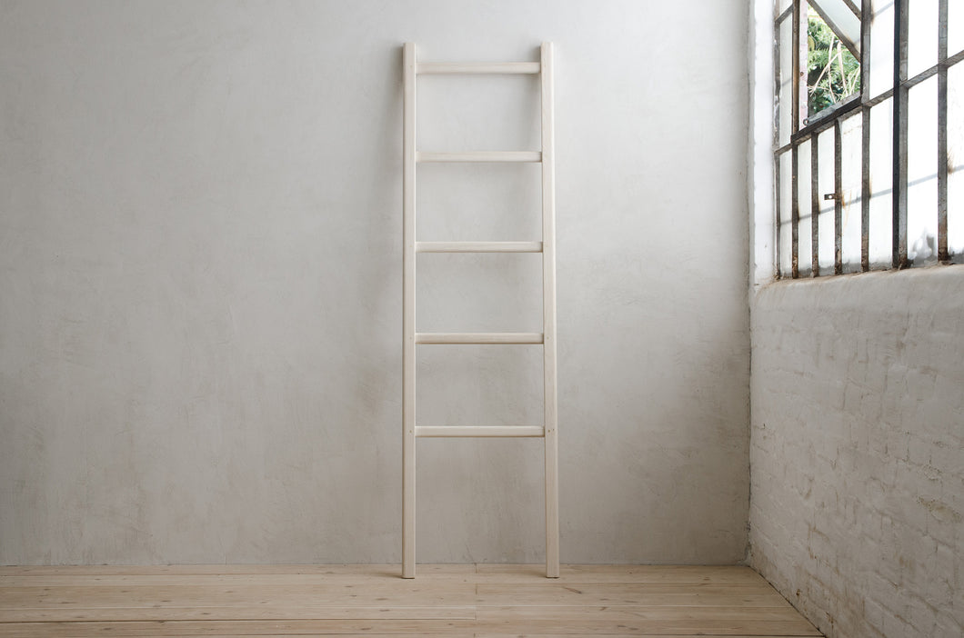 Lore Ladder in Bleached Ash Leaning Against Concrete Wall In Modern Room