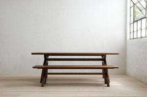 Inyo Bench at Inyo Table in Natural Walnut in a Modern Room