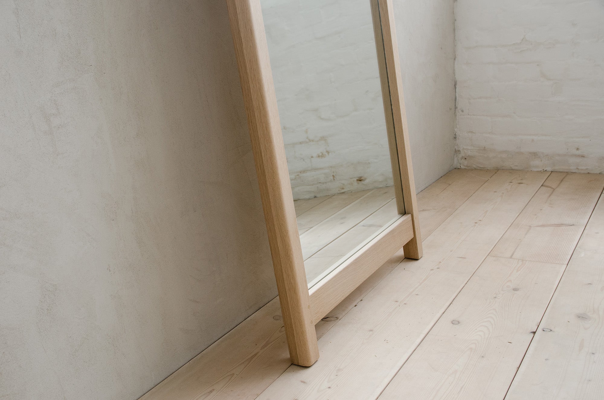 Closeup of Bottom of Lore Standing Mirror in Natural White Oak