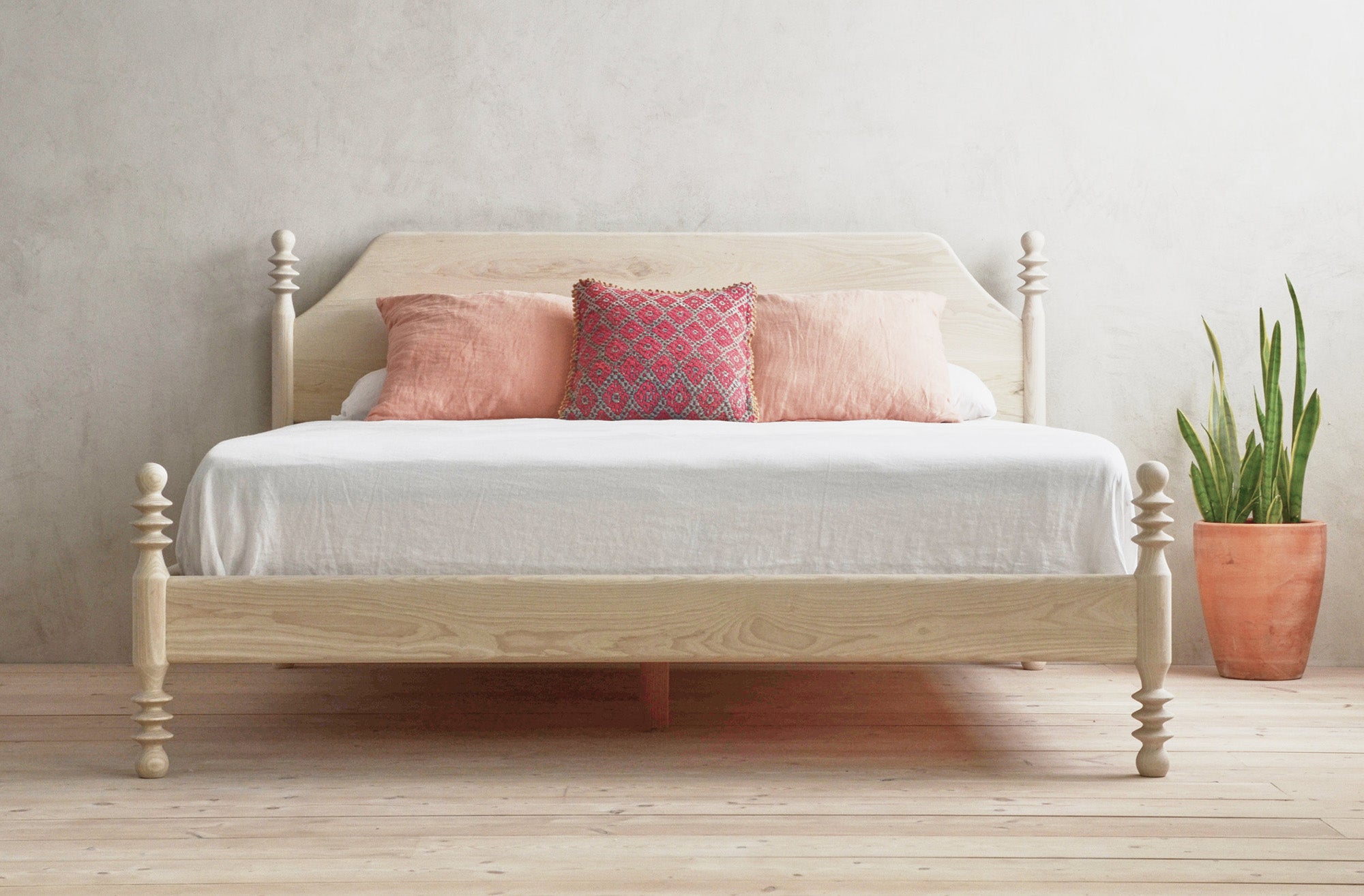 Flora Bed in Bleached Ask With Pink Pillows and Plant