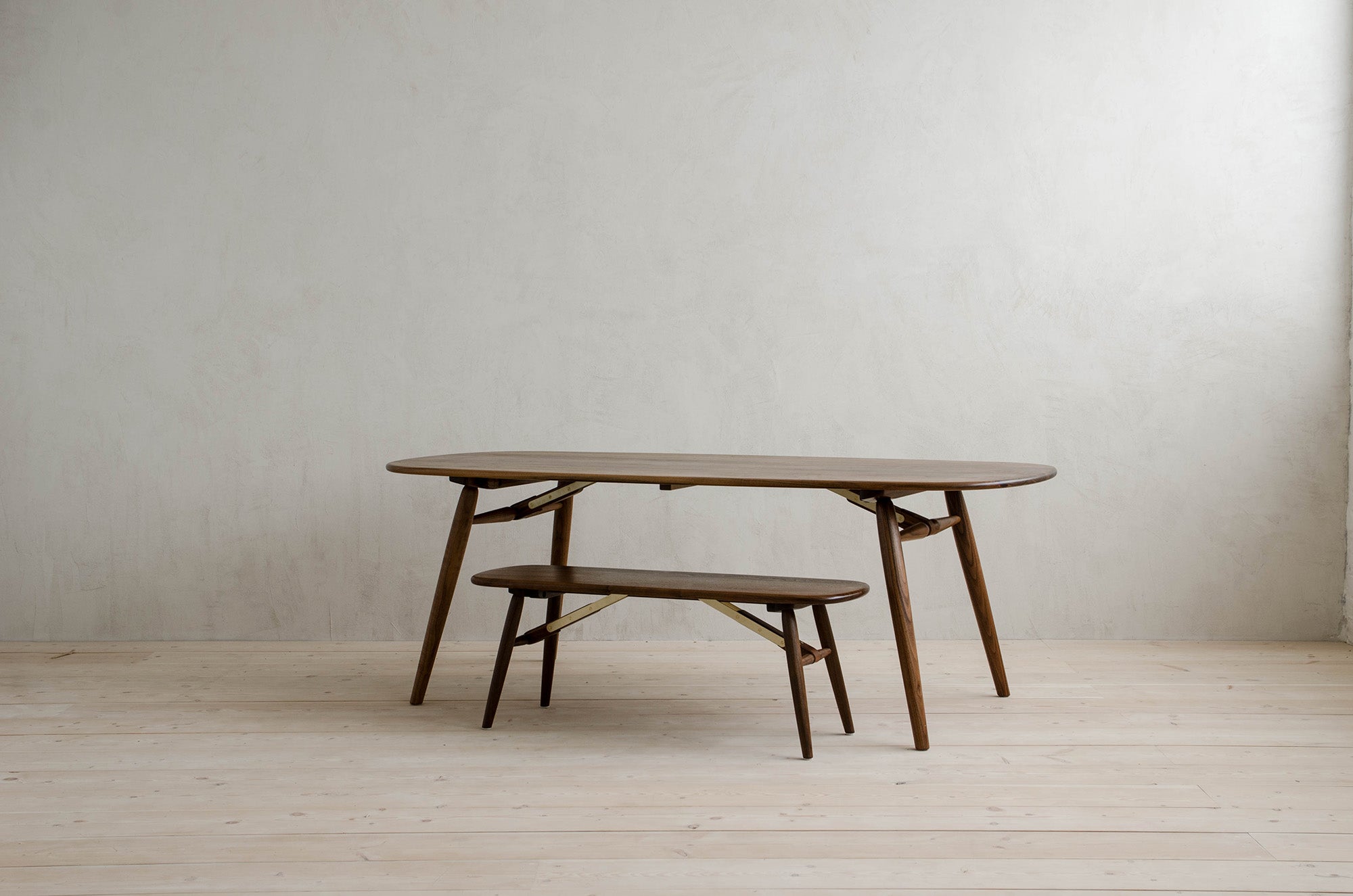 Natural Walnut Nomad Table Stacked on top of Nomad Bench 