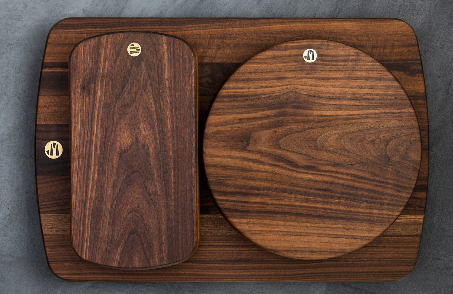 Four Hudson Cutting Boards in Different Shapes and Sizes Stacked