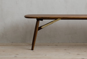 Closeup Of Natural Walnut Nomad Bench With Brass Features